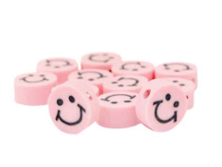 licht roze smiley polymeer kraal 1st